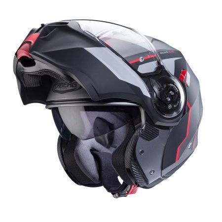 Casco modulare Caberg Duke Evo Move metallo grigio opaco, nero e rosso, vista a tre quarti con mentoniera aperta, design moderno con visiera trasparente.