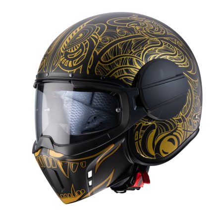 Caberg Ghost Maori Jet Helmet in matte black and gold, three-quarter view, aggressive design with Maori graphics.