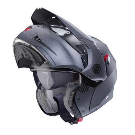 Tourmax-X-Matt-Gun-Metal-3-4-open Caberg Tourmax X modular helmet in matte metallic grey, three-quarter view with chin guard open, modern design with clear visor.