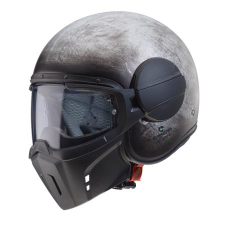 Caberg Ghost Iron full-face helmet, three-quarter view, robust design, distressed steel color, with clear visor.<br><br>
